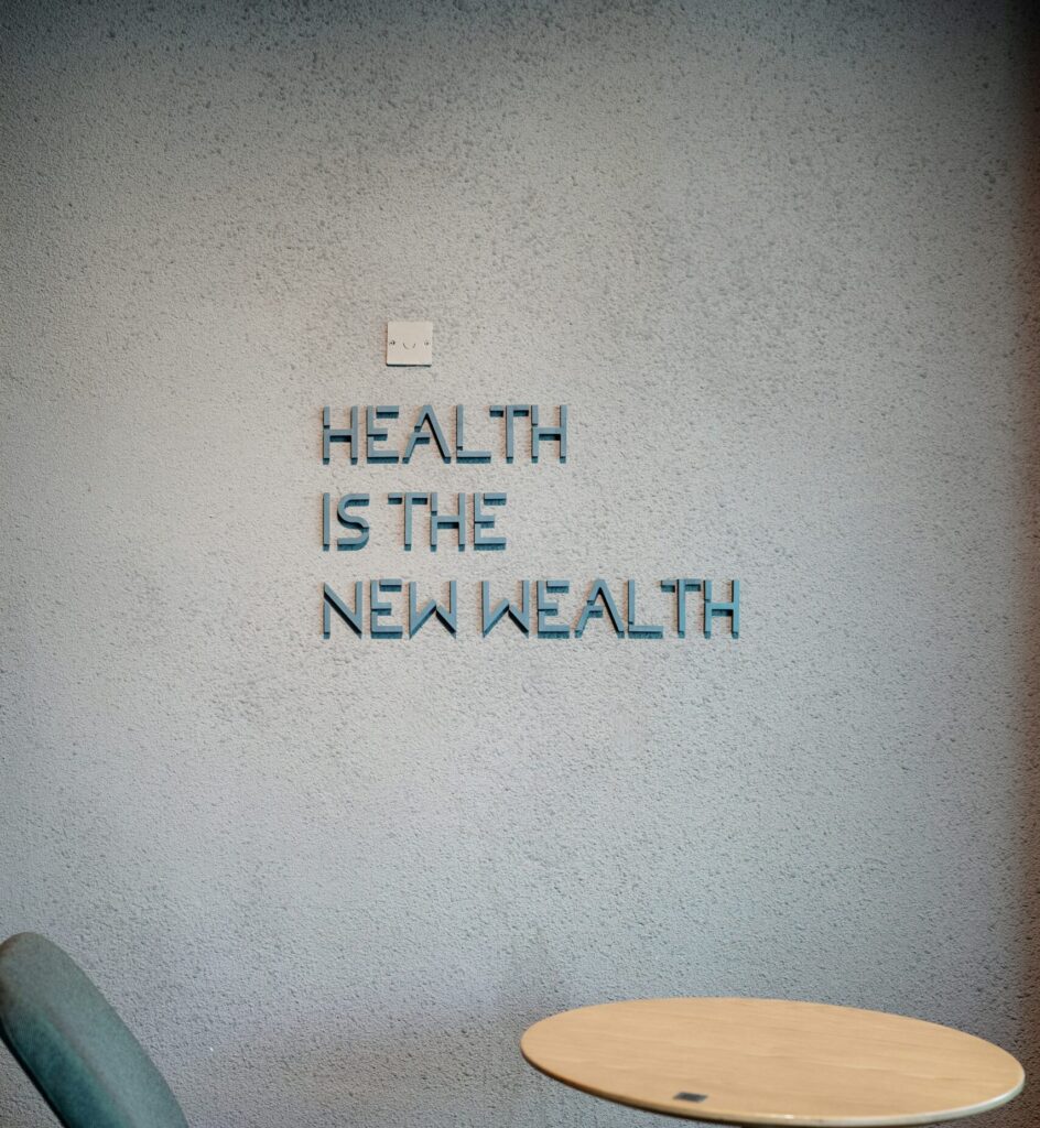 Wall display with the message “Health is the new wealth” in a modern indoor space