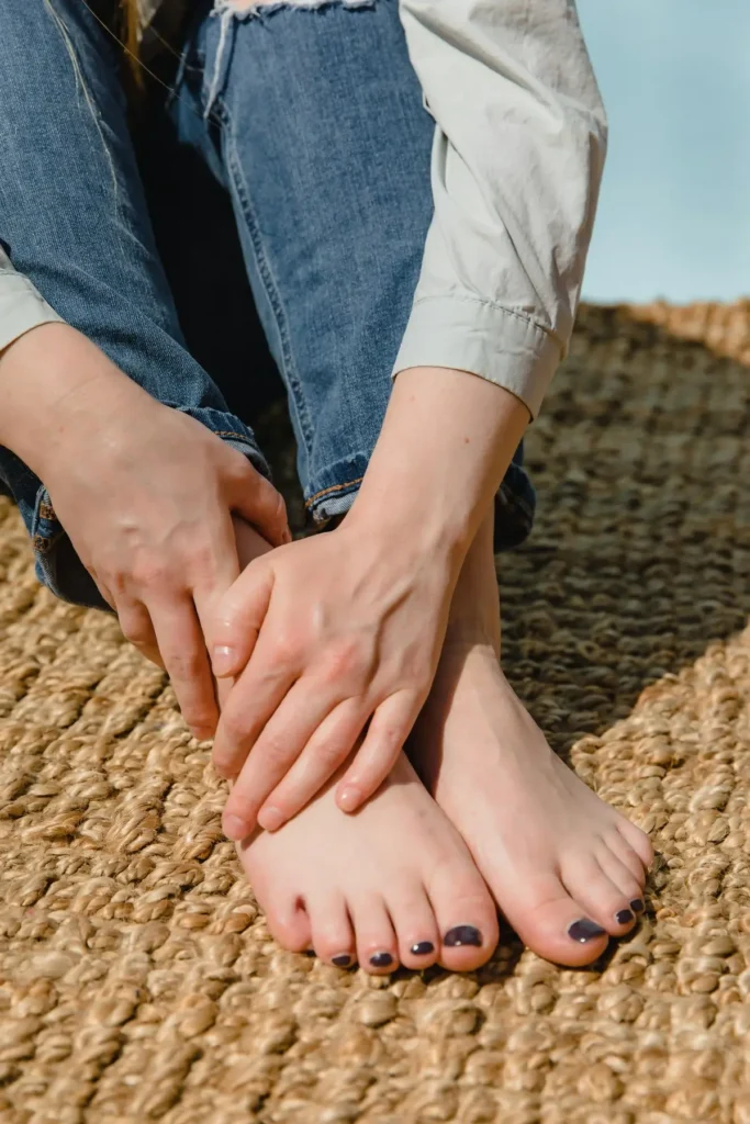 Person experiencing tingling sensation in hands and feet